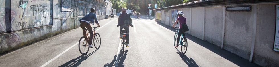 Urban cylists riding on hybrid bikes